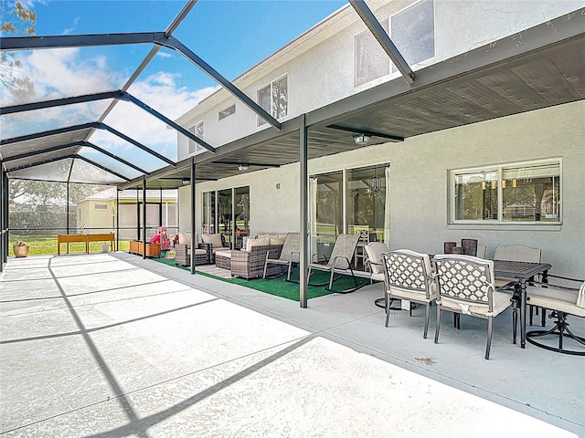18109 Kara Ct, Tampa, FL 33647 - view of patio / terrace with an outdoor hangout area, outdoor dining space, and glass enclosure