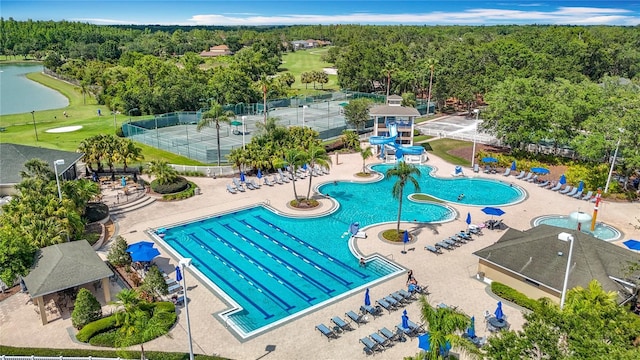 18109 Kara Ct, Tampa, FL 33647 - community pool with a water slide, a water play area, a water view, and view of golf course