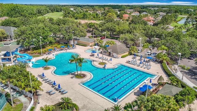 18109 Kara Ct, Tampa, FL 33647 - community pool with a water slide and a patio