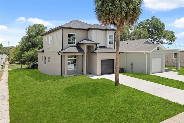 811 E Mcdonald Ave, Eustis, FL 32726 - view of front of property with concrete driveway, a front lawn, roof with shingles, an attached garage, and central AC