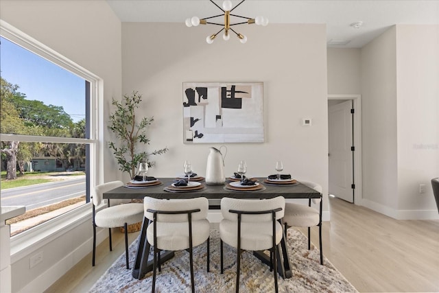 811 E Mcdonald Ave, Eustis, FL 32726 - dining space with plenty of natural light, a chandelier, and light wood-type flooring