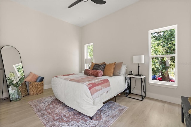811 E Mcdonald Ave, Eustis, FL 32726 - bedroom with wood finished floors, baseboards, and ceiling fan