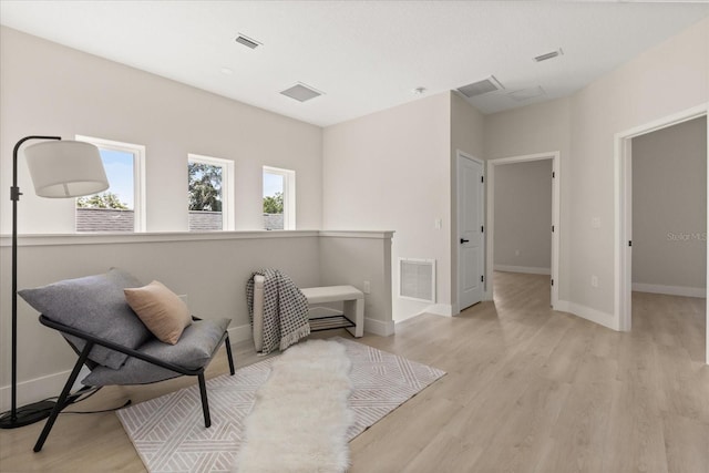 811 E Mcdonald Ave, Eustis, FL 32726 - sitting room with plenty of natural light, light wood-style floors, and baseboards
