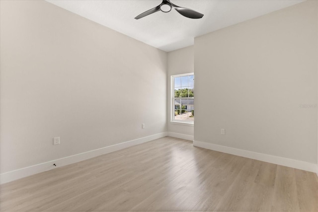 811 E Mcdonald Ave, Eustis, FL 32726 - unfurnished room with a ceiling fan, light wood-style floors, and baseboards
