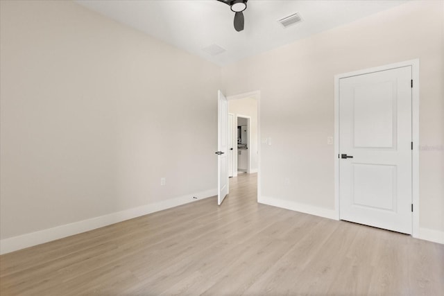 811 E Mcdonald Ave, Eustis, FL 32726 - unfurnished room with light wood-style flooring, a ceiling fan, and baseboards