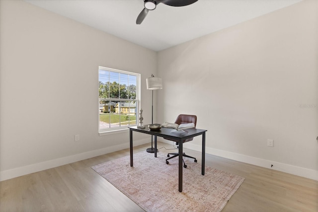 811 E Mcdonald Ave, Eustis, FL 32726 - office space with a ceiling fan, wood finished floors, and baseboards