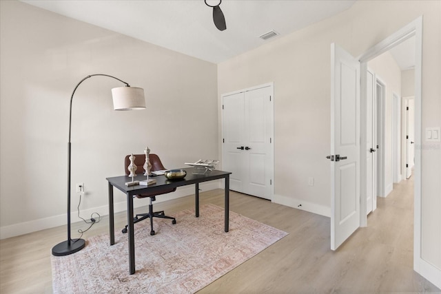 811 E Mcdonald Ave, Eustis, FL 32726 - office area featuring light wood-style floors and baseboards