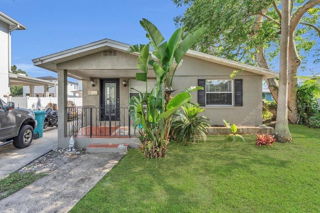 232 E Grant St, Orlando, FL 32806 - bungalow-style home featuring stucco siding and a porch