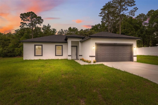 10218 N Langdon Rd, Citrus Springs, FL 34434 - prairie-style home featuring a garage, stucco siding, and concrete driveway