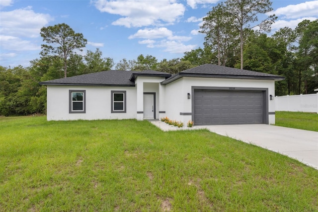 10218 N Langdon Rd, Citrus Springs, FL 34434 - prairie-style home with stucco siding, a garage, concrete driveway, and a shingled roof