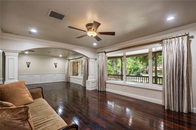 2009 Woody Dr, Windermere, FL 34786 - living room featuring ornate columns, arched walkways, a ceiling fan, crown molding, and hardwood / wood-style flooring