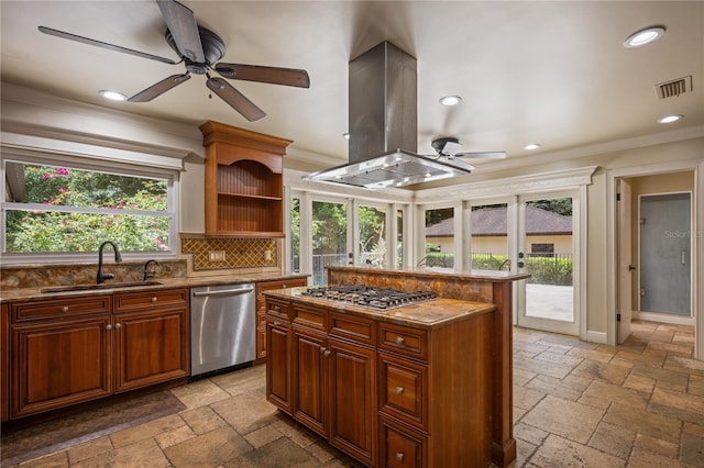 2009 Woody Dr, Windermere, FL 34786 - kitchen with stainless steel appliances, island range hood, a sink, ceiling fan, and stone tile flooring