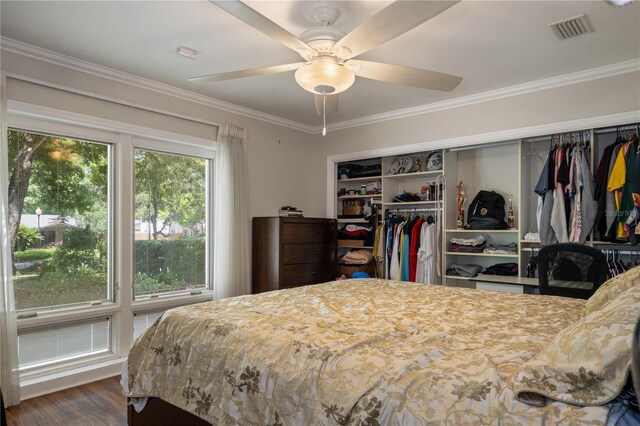 2009 Woody Dr, Windermere, FL 34786 - bedroom featuring ornamental molding, wood finished floors, a closet, and ceiling fan
