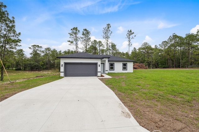 2565 W Laredo Dr, Citrus Springs, FL 34433 - view of front facade with stucco siding, a garage, concrete driveway, and a front lawn