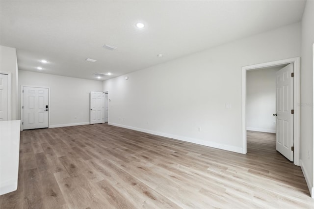 2565 W Laredo Dr, Citrus Springs, FL 34433 - spare room with light wood-style floors, baseboards, and recessed lighting