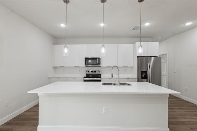 2565 W Laredo Dr, Citrus Springs, FL 34433 - kitchen with appliances with stainless steel finishes, a sink, a center island with sink, white cabinets, and light countertops