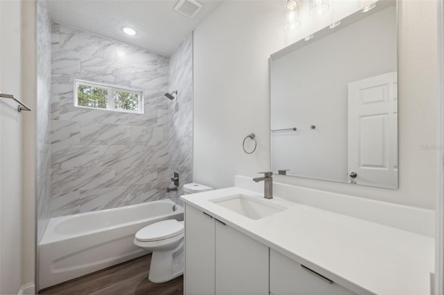 2565 W Laredo Dr, Citrus Springs, FL 34433 - full bath featuring vanity, toilet, bathtub / shower combination, and wood finished floors