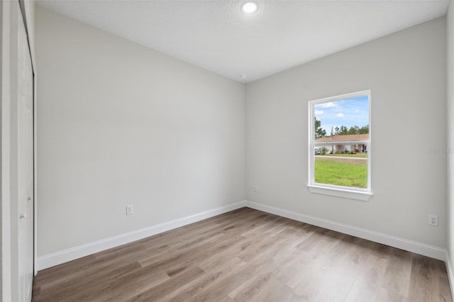 2565 W Laredo Dr, Citrus Springs, FL 34433 - empty room with light wood finished floors, baseboards, and recessed lighting