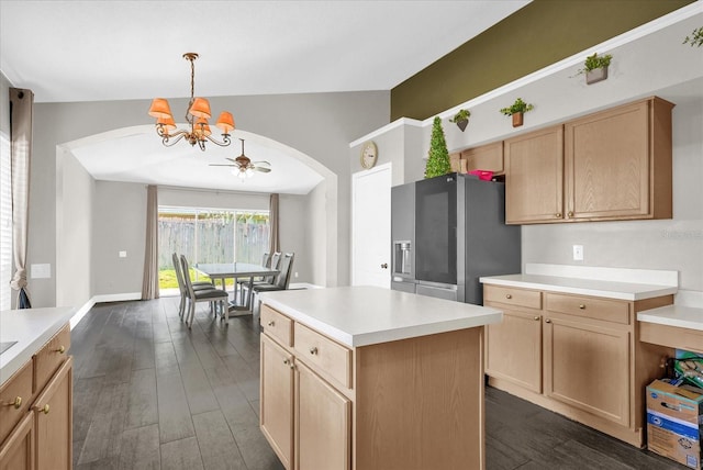 10930 Buckwater Ct, Orlando, FL 32817 - kitchen featuring stainless steel fridge with ice dispenser, arched walkways, a chandelier, dark wood-style flooring, and light brown cabinetry