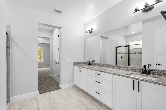 30369 Apricot Ave, Eustis, FL 32736 - bathroom featuring a stall shower and double vanity