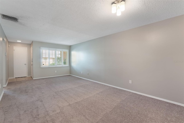 1230 Americana Pl, Orlando, FL 32807 - unfurnished room featuring a textured ceiling, light colored carpet, and baseboards