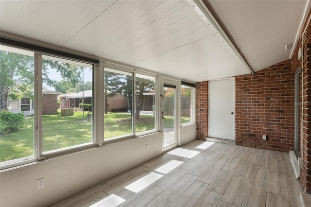 1230 Americana Pl, Orlando, FL 32807 - unfurnished sunroom with plenty of natural light and lofted ceiling