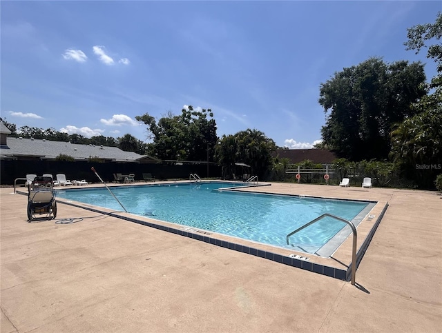 1230 Americana Pl, Orlando, FL 32807 - community pool featuring a patio area