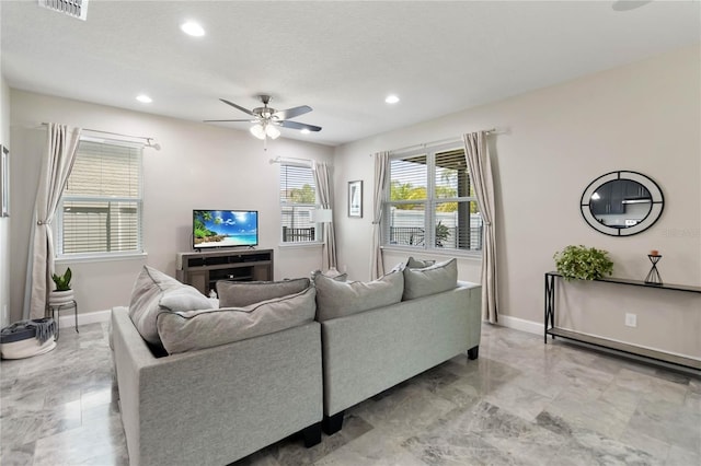 3883 Crawley Down Loop, Sanford, FL 32773 - living area with a ceiling fan, light marble finish floors, recessed lighting, and baseboards