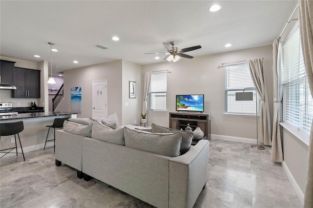 3883 Crawley Down Loop, Sanford, FL 32773 - living area with recessed lighting, baseboards, ceiling fan, and healthy amount of natural light