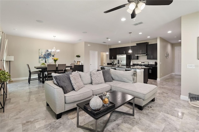 3883 Crawley Down Loop, Sanford, FL 32773 - living room featuring baseboards, recessed lighting, ceiling fan, and a chandelier