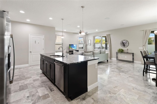 3883 Crawley Down Loop, Sanford, FL 32773 - kitchen with appliances with stainless steel finishes, a sink, ceiling fan, recessed lighting, and dark stone counters
