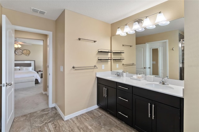 3883 Crawley Down Loop, Sanford, FL 32773 - ensuite bathroom with double vanity and baseboards