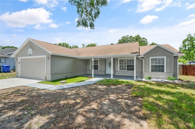 5160 Wood Ridge Ct, Ocoee, FL 34761 - single story home featuring an attached garage, a porch, driveway, and brick siding