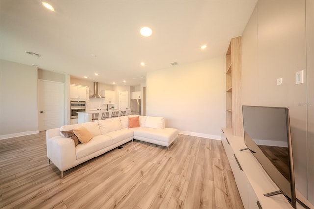 16055 Silver Brook Way, Winter Garden, FL 34787 - living room with light wood-style flooring, baseboards, and recessed lighting