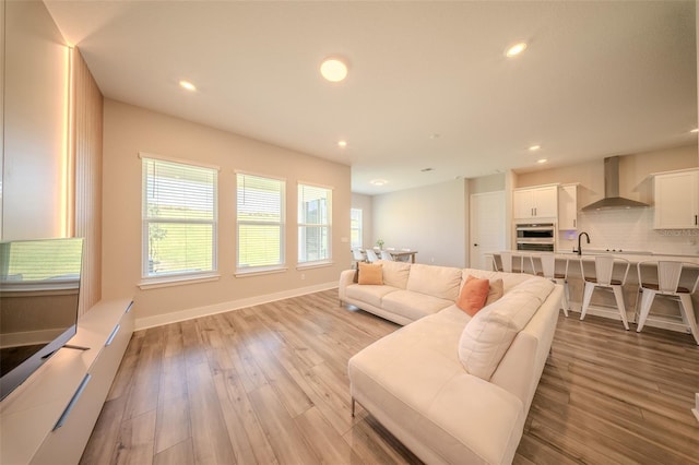 16055 Silver Brook Way, Winter Garden, FL 34787 - living area featuring recessed lighting, light wood finished floors, and baseboards