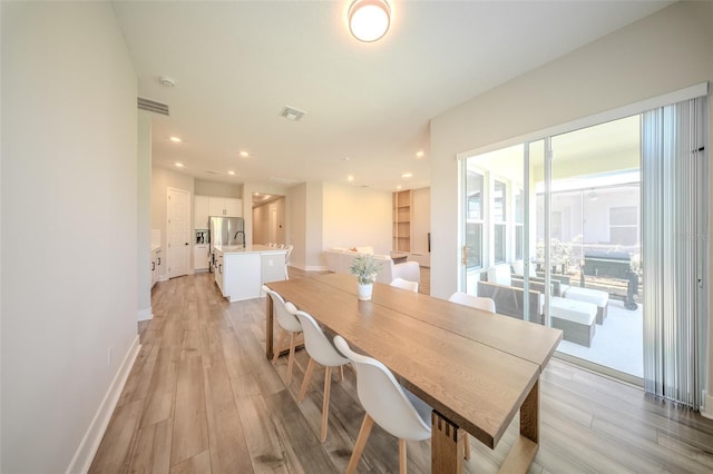 16055 Silver Brook Way, Winter Garden, FL 34787 - dining room featuring light wood finished floors, baseboards, and recessed lighting