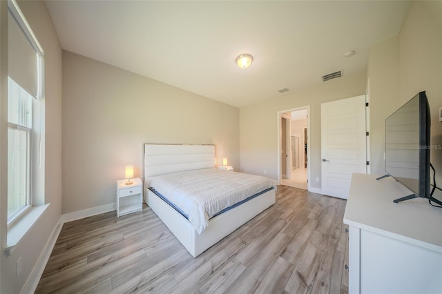 16055 Silver Brook Way, Winter Garden, FL 34787 - bedroom with light wood-style floors and baseboards