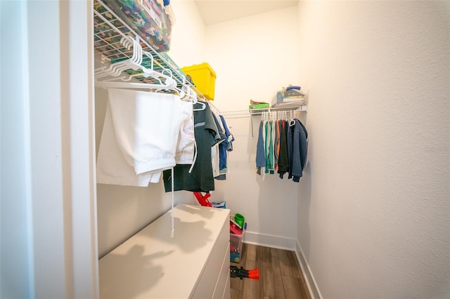 16055 Silver Brook Way, Winter Garden, FL 34787 - walk in closet featuring wood finished floors