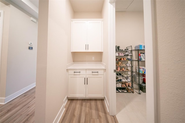 16055 Silver Brook Way, Winter Garden, FL 34787 - corridor featuring light wood-style flooring and baseboards
