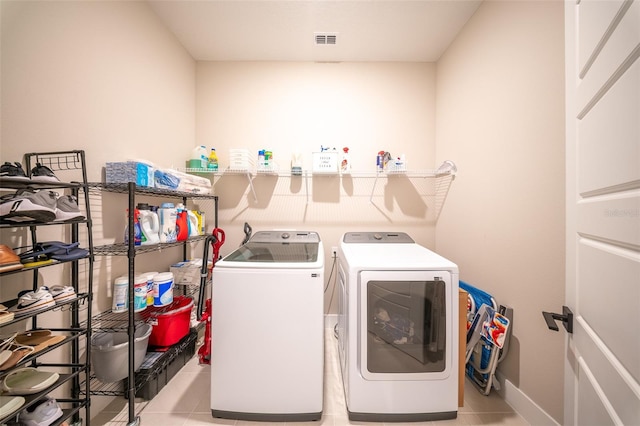 16055 Silver Brook Way, Winter Garden, FL 34787 - laundry room featuring washer and dryer and light tile patterned floors
