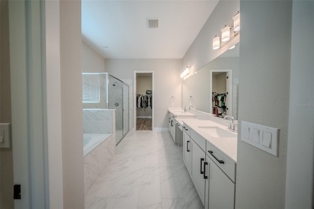 16055 Silver Brook Way, Winter Garden, FL 34787 - full bath with a spacious closet, a stall shower, double vanity, and marble finish flooring