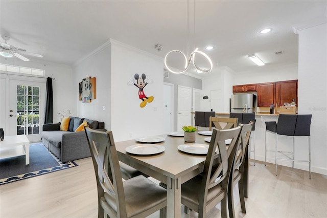 1375 Tuscana Ln Unit 1102, Davenport, FL 33896 - dining area featuring light wood-type flooring, crown molding, a ceiling fan, and recessed lighting