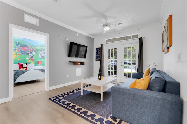 1375 Tuscana Ln Unit 1102, Davenport, FL 33896 - living area with french doors, wood finished floors, ornamental molding, ceiling fan, and baseboards