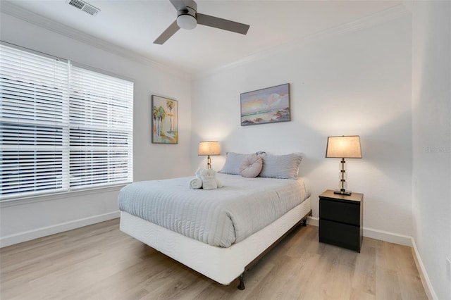 1375 Tuscana Ln Unit 1102, Davenport, FL 33896 - bedroom featuring crown molding, wood finished floors, baseboards, and a ceiling fan