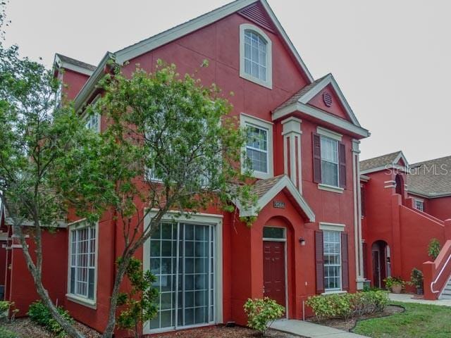 9584 Lake Chase Island Way Unit 958, Tampa, FL 33626 - view of front of property featuring stucco siding