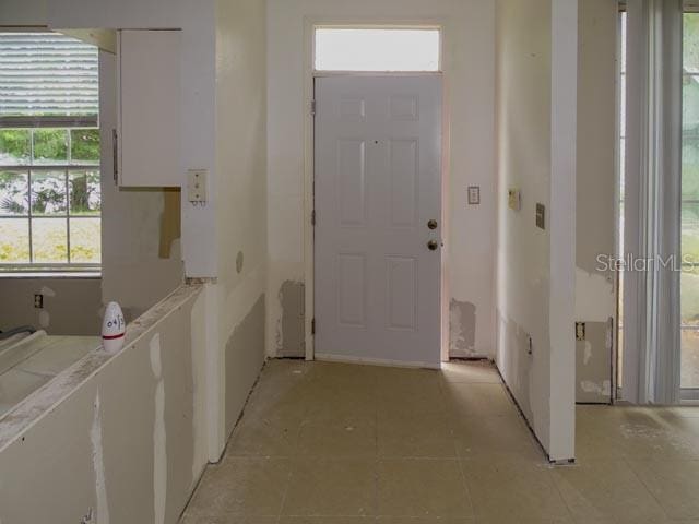 9584 Lake Chase Island Way Unit 958, Tampa, FL 33626 - corridor with light tile patterned floors