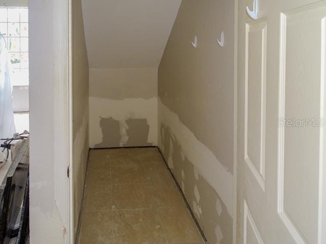 9584 Lake Chase Island Way Unit 958, Tampa, FL 33626 - hall with tile patterned flooring