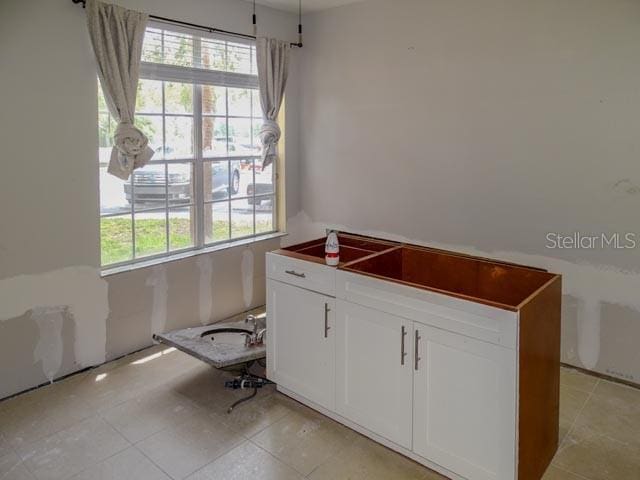 9584 Lake Chase Island Way Unit 958, Tampa, FL 33626 - home office featuring light tile patterned flooring