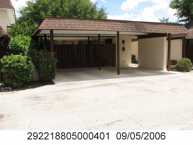 2235 Silver Pines Pl Unit 401, Orlando, FL 32808 - view of parking / parking lot featuring a carport