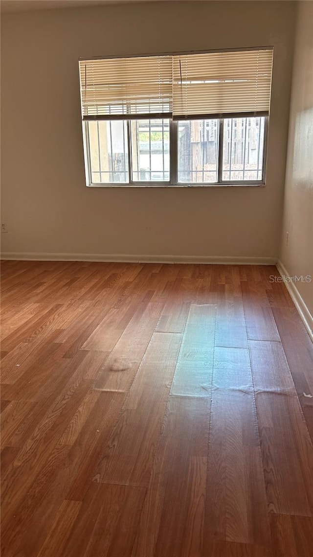 2235 Silver Pines Pl Unit 401, Orlando, FL 32808 - unfurnished room featuring wood finished floors and baseboards